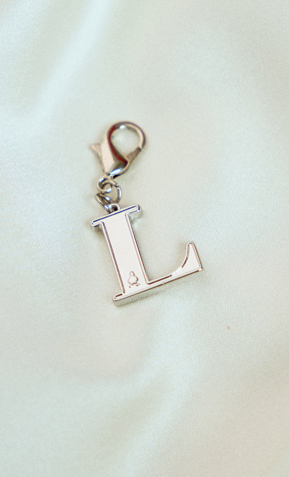 Alphabet dUCk Charm in L